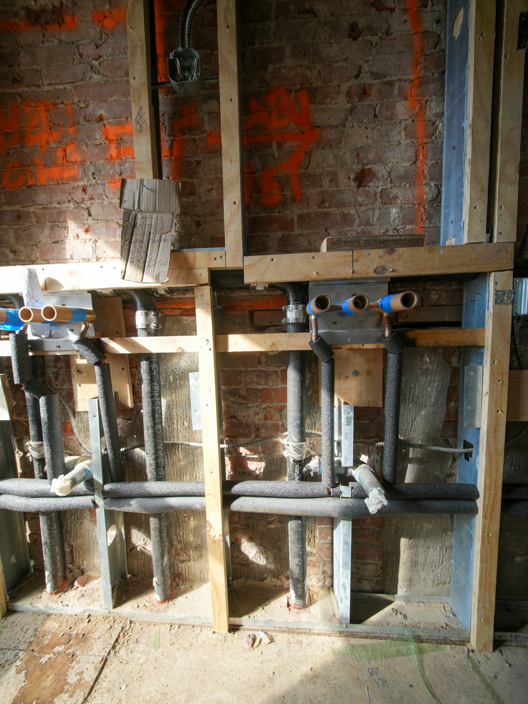 Pipework in an open wall during first fix